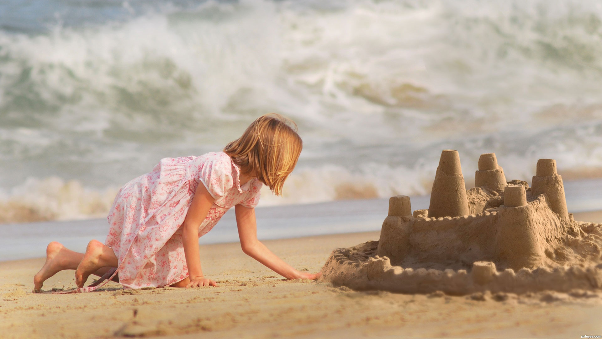 "Sandcastle" is a Photoshop composite image from three originals: a girl kneeling on beach sand, a large sandcastle, and rolling ocean waves in the background.